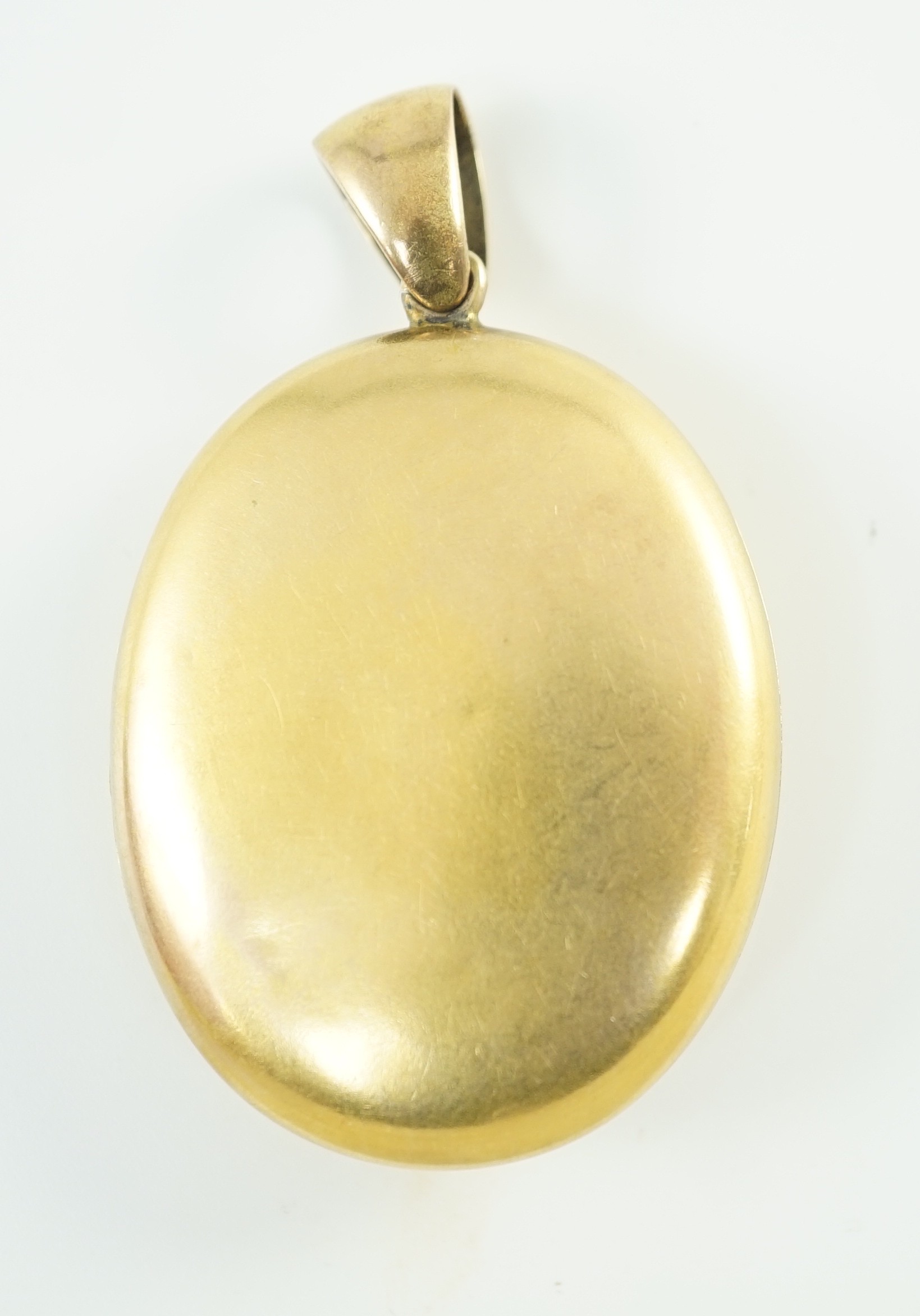 A Victorian gold and rose cut diamond set oval pendant locket